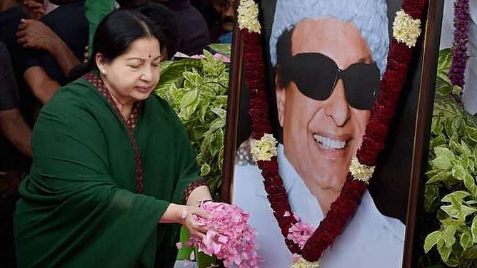 

Jayalalithaa paying floral tribute to former chief minister and AIADMK founder MGR. (Photo: PTI)