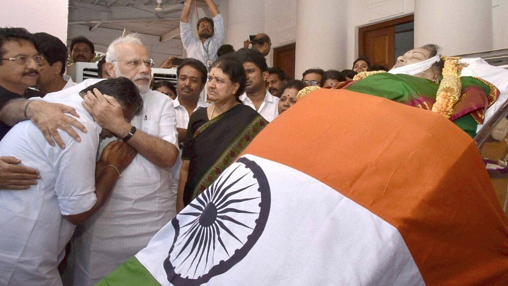 Prime Minister Narendra Modi consoling O Panneerselvam and Sasikala at J Jayalalithaa’s funeral on 6 December 2016. (Photo: PTI)