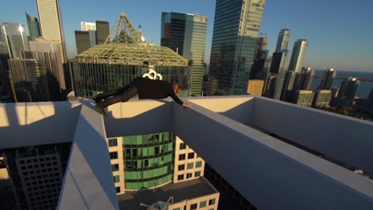 This man is making Toronto’s skyscrapers look really small! (Image: AP Screengrab)