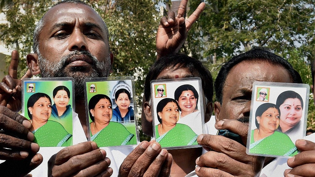People hold up cards showing Sasikala Natarajan with late Tamil Nadu CM J Jayalalithaa in Chennai. (Photo: PTI)