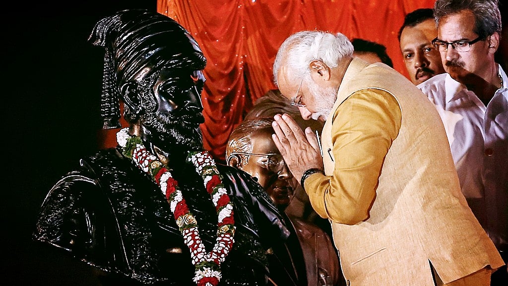 Prime Minister Narendra Modi gesturing at the statue of Chhatrapati Shivaji during an election campaign rally in Mumbai on 21 April 2014. (Photo: Reuters)&nbsp;