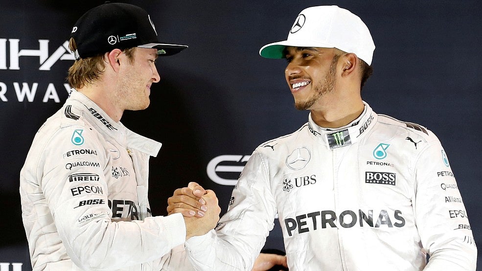 Mercedes’ Formula One driver Nico Rosberg (L) of Germany shakes hands with Lewis Hamilton of Britain. (Photo: Reuters)