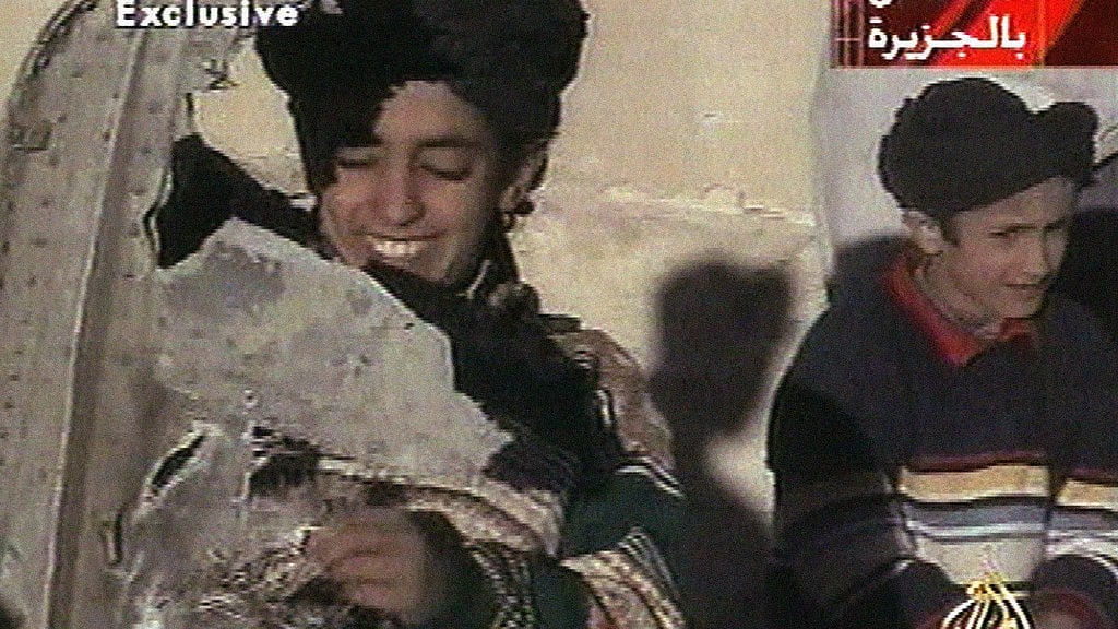 In this image from video broadcast by television station Al-Jazeera on 7 November 2001, the young boy, left, is identified as Hamza bin Laden. (Photo: AP)