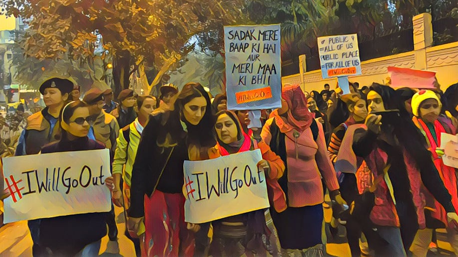 Women march holding banners of #IWillGoOut. (Photo: Maanvi/<b>The Quint</b>)