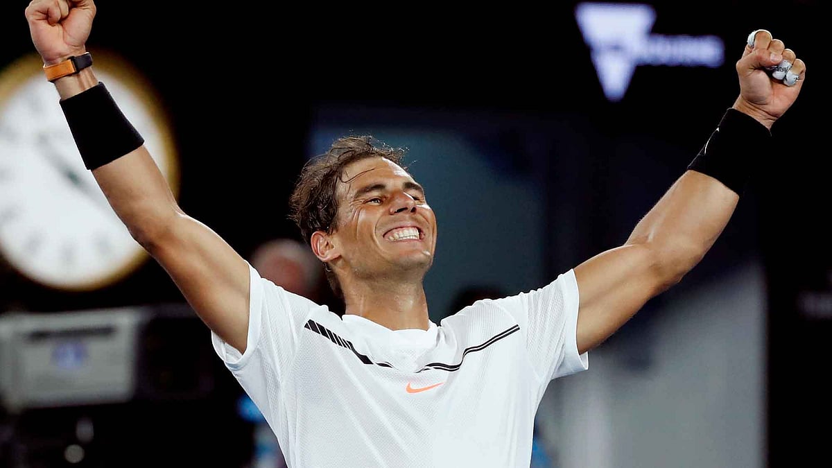 Rafael Nadal celebrates after winning his Australian Open quarterfinals. (Photo: AP)