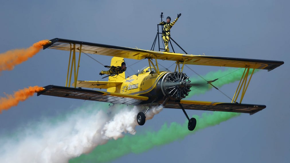 Scandinavian Skycats wave at spectators during AeroIndia2017 inauguration at Bengaluru on Tuesday. (Photo Courtesy: Twitter/<a href="https://twitter.com/SpokespersonMoD">Spokesperson MOD</a>)