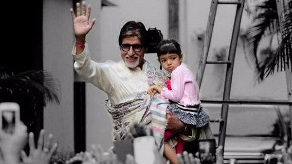 Big B poses with granddaughter Aaradhya outside his home. 