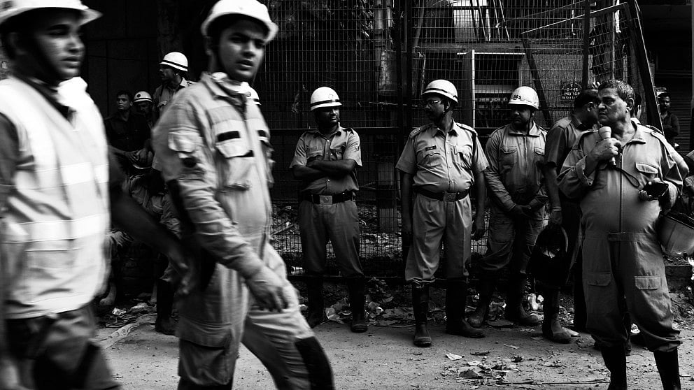 Firemen at a fire site at Narela, Delhi, where two firemen died while fighting fire.