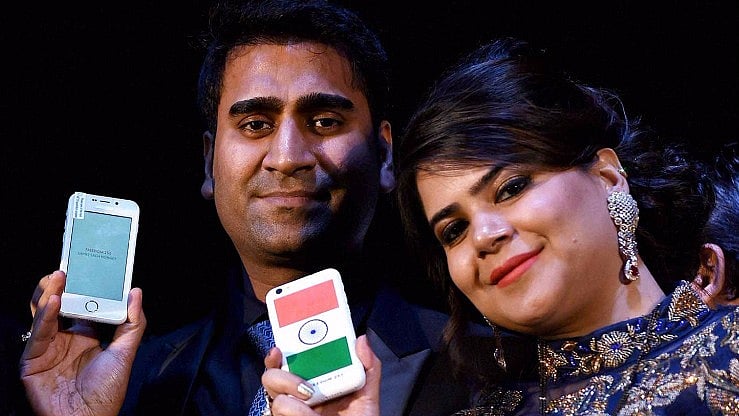 Ringing Bells Director Mohit Goel (left) with CEO Dhaarna Goel during the launch event holding Freedom 251. 