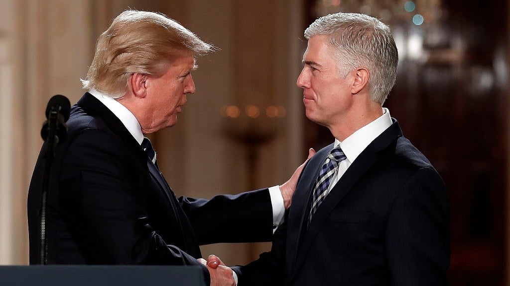 President Donald Trump shakes hands with 10th US Circuit Court of Appeals Judge Neil Gorsuch, his choice for Supreme Court associate justice in the East Room of the White House in Washington, Tuesday. (Photo: AP)<a></a>
