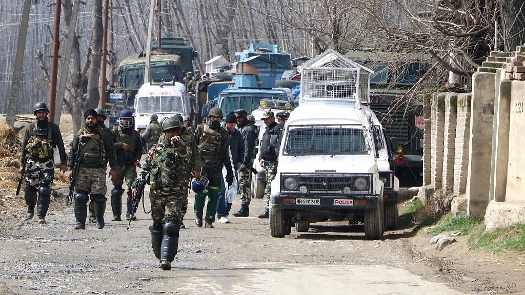 Soldiers in action during a gunfight between security forces and militants at Padgampora village in Jammu & Kashmir’s Pulwama district. (Photo: IANS)