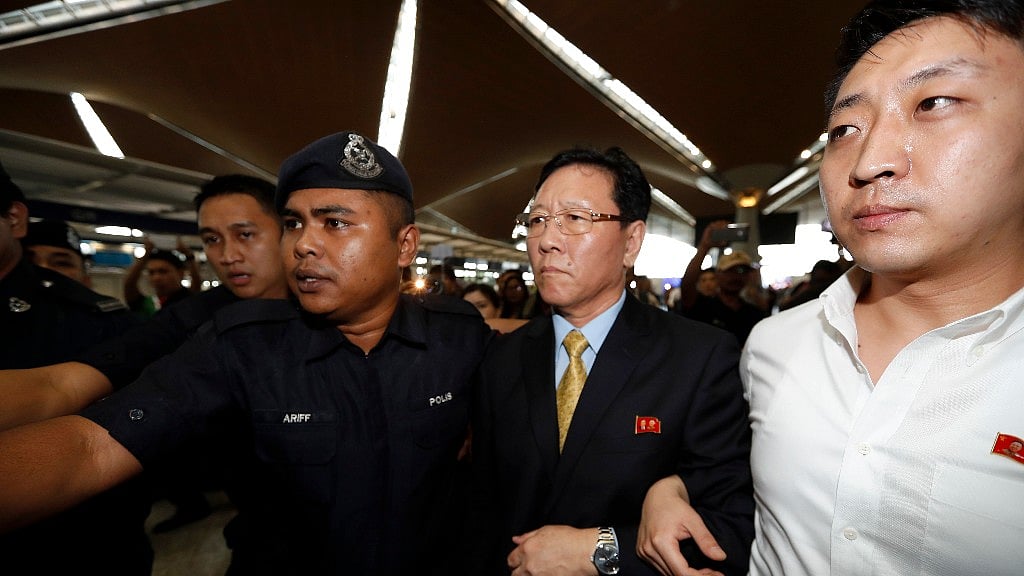 North Korean Ambassador to Malaysia Kang Chol (second from right) arrives at Kuala Lumpur International Airport in Sepang, Malaysia on Monday. (Photo: AP)