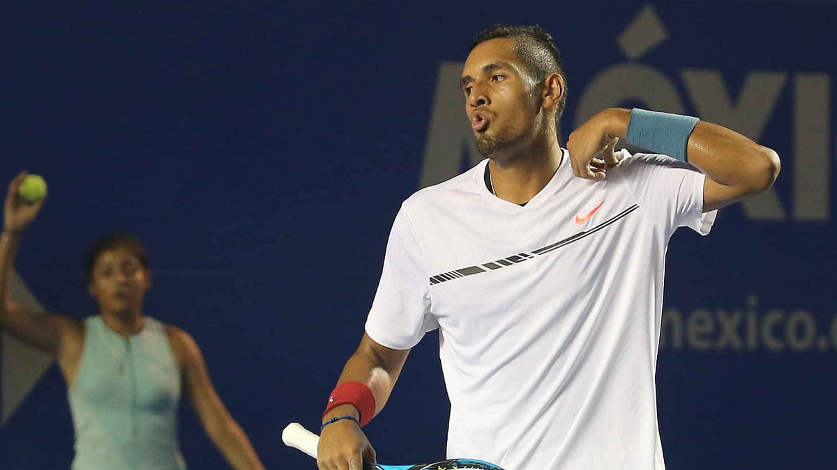 Australia’s Nick Kyrgios reacts after winning a point against Serbia’s Novak Djokovic. (Photo: AP)
