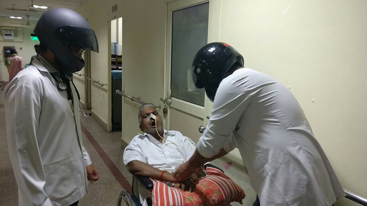Doctors at AIIMS wear helmets to work on Wednesday. (Photo: ANI Screengrab)
