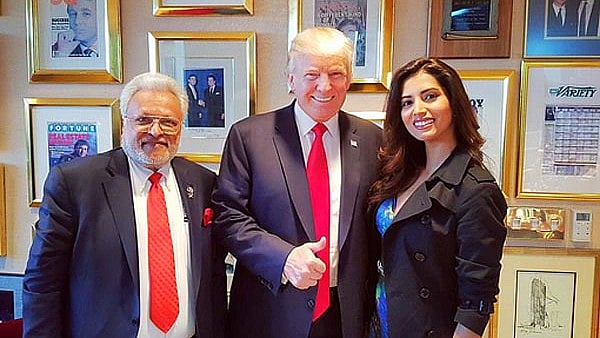 

US President Donald Trump flanked by Shalabh Kumar of Republican Hindi Coalition and his god-daughter Manasvi Mamgai. (Image courtesy: twitter.com/<a href="https://twitter.com/imanasvi">@imanasvi</a>)