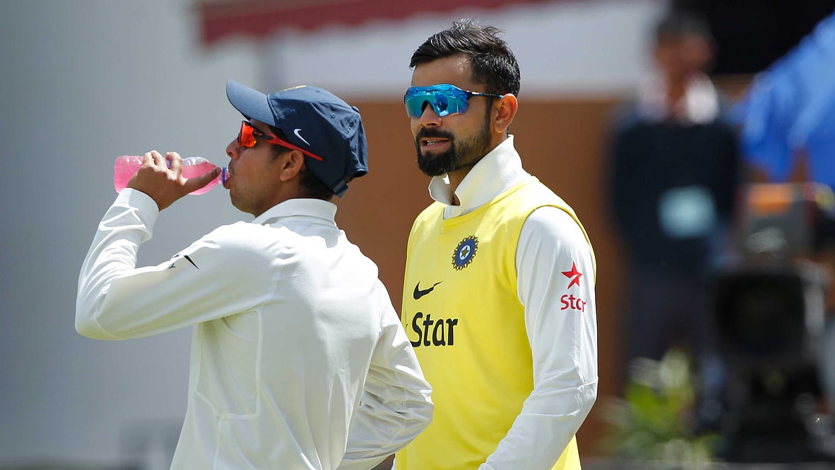 Virat Kohli met Kuldeep Yadav on the sidelines after his first wicket. (Photo: BCCI)