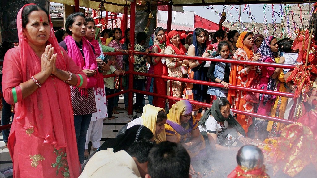 Devotees offer prayers in the historic Kali Mata Temple on the first day of Navratri in Jammu on Tuesday. (Photo: PTI)
