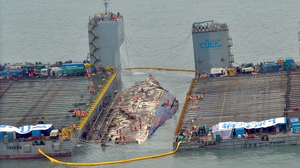 Workers prepare to lift the 6,800-tonne ferry (Photo: AP)