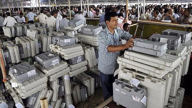 Polling officials collecting Electronic Voting Machine (EVM) during 2014 Lok Sabha elections.