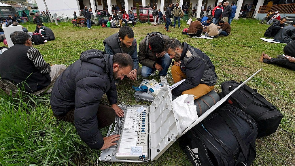 Polling staff checking EVMs before heading to polling station for the by-election to the Srinagar Lok Sabha seat on Saturday. (Photo: PTI)