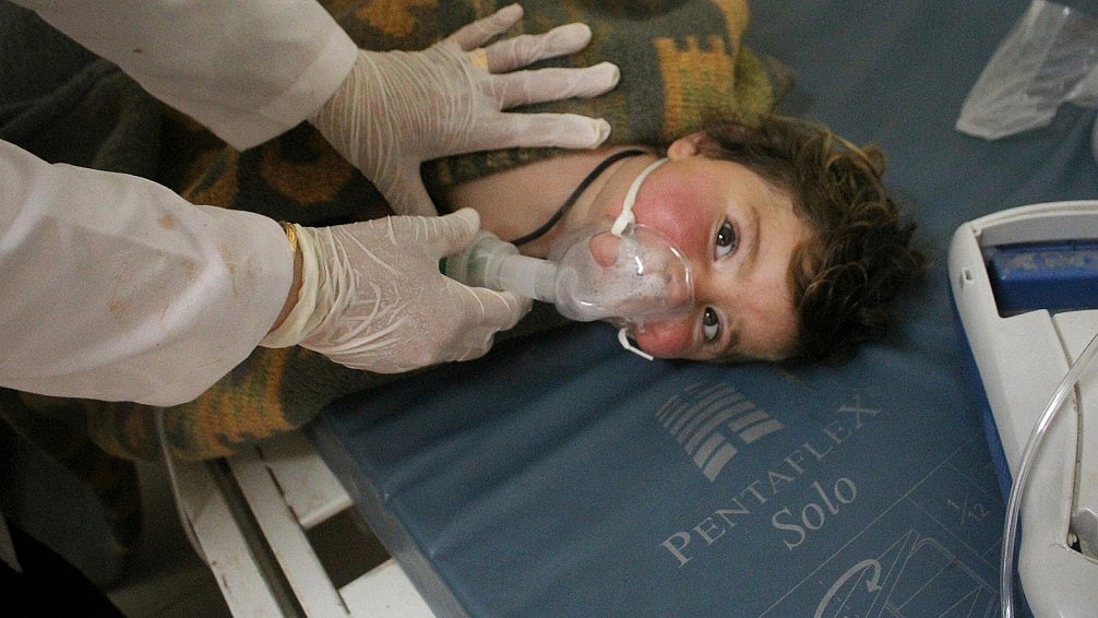 A Syrian doctor treating a child following a suspected chemical attack, at a makeshift hospital, in the town of Khan Sheikhoun, northern Idlib province, Syria. (Photo: AP)