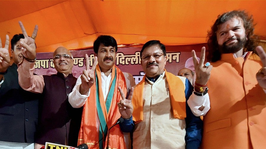 Delhi BJP President and MP, Manoj Tiwari, BJP incharge of Delhi Shyam Jaju, Hans Raj Hans and others during a press conferecne after BJP posted a huge victory in the MCD elections, in New Delhi on Wednesday. (Photo: PTI)