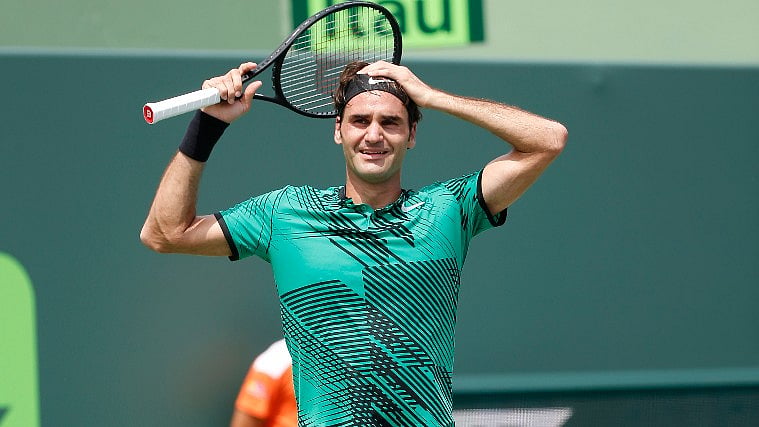 Roger Federer celebrates after beating Rafael Nadal in the Miami Open final on Sunday. (Photo: AP)
