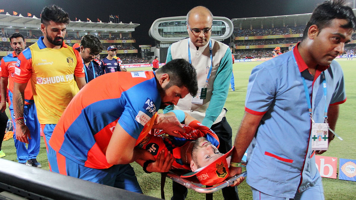 Gujarat Lions’ all-rounder Andrew Tye is being taken off the field on a stretcher during the match against Mumbai Indians on Saturday. (Photo: BCCI)