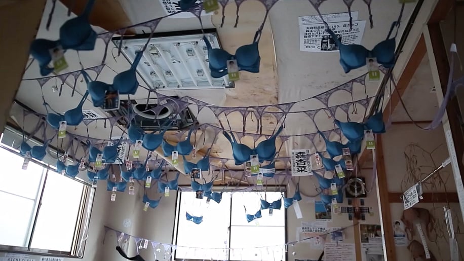 Women’s lingerie strewn across the walls and ceilings of the temple (Photo: Ruptly Screengrab)
