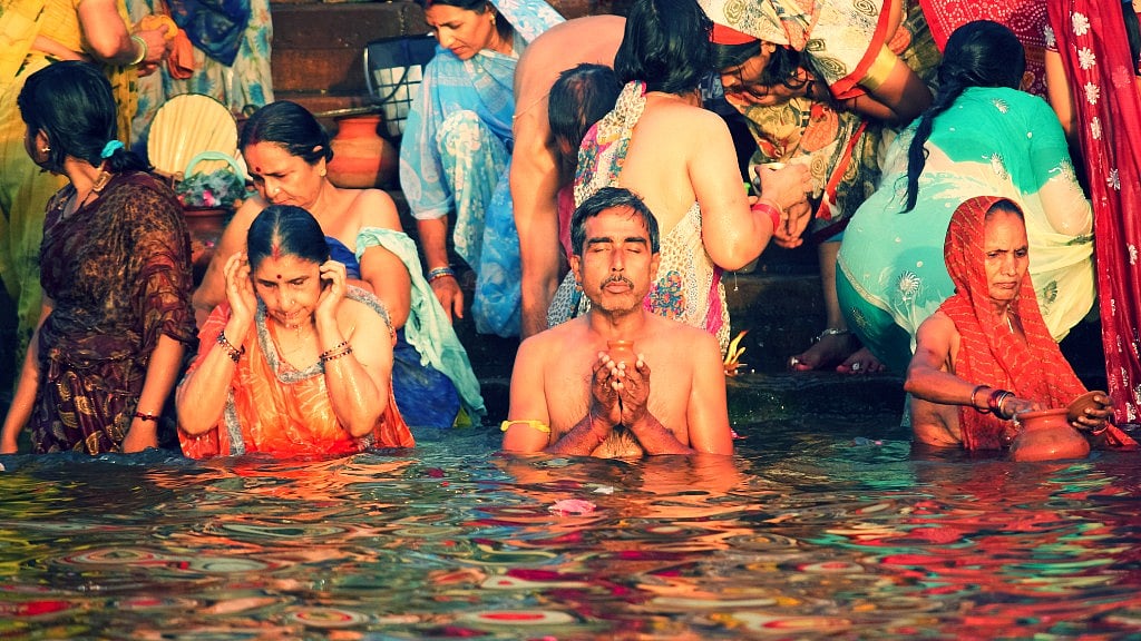 The young and old celebrate the confluence of ignorance towards filth and religious fervour with a dip into the Ganga. (Photo: iStock)