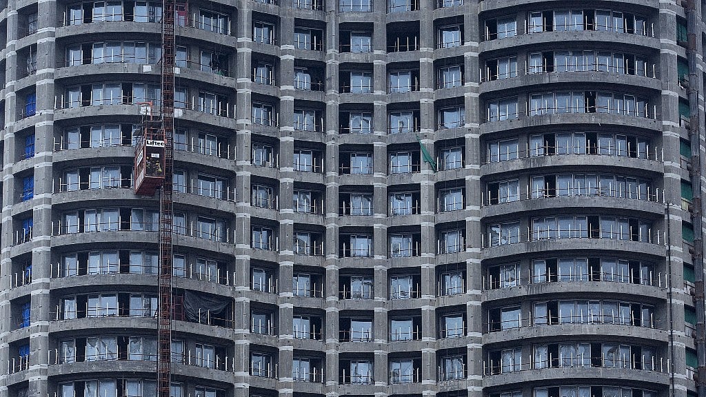Workers take a lift at an under-construction high-rise residential tower
in central Mumbai. (Picture: Reuters)