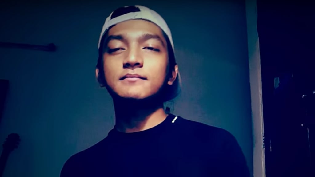 JNU student Rahul Rajkhowa raps against the recent announcement of seat cuts in M Phil and PhD courses. (Photo: YouTube screengrab)