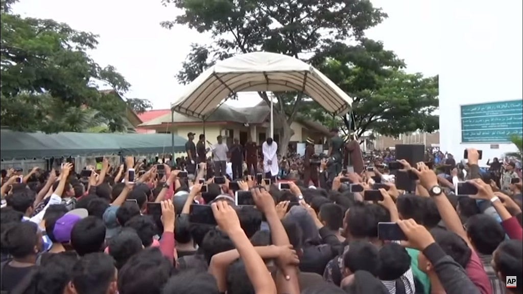 The two gay men were publicly flogged in front of a crowd of over 1,000 people. (Photo: AP Screengrab)