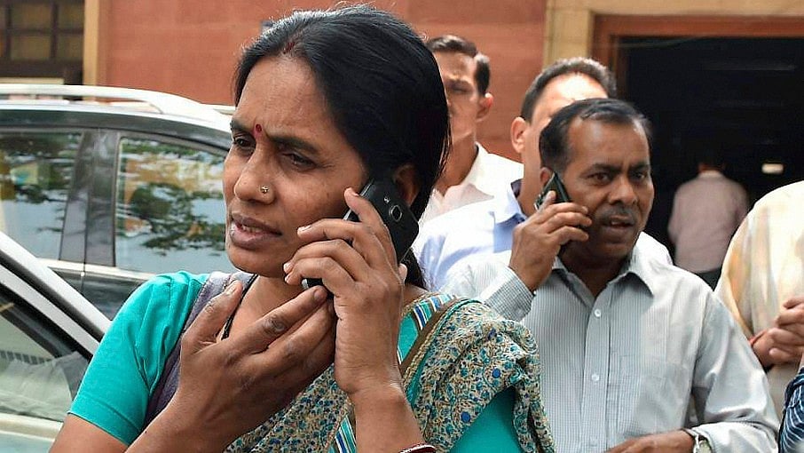 Jyoti Singh’s mother Asha Singh (left)<i> </i>and father Badri Singh seen outside the Supreme Court after the death sentence for all the four convicts was upheld on Friday. (Photo: PTI)