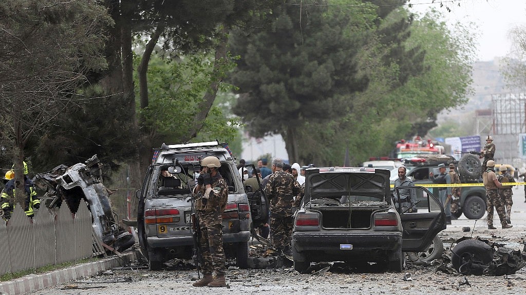 Security forces inspect the site of a suicide attack in Kabul, Afghanistan. (Photo: AP)