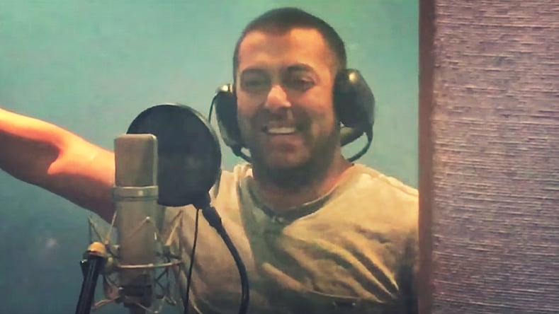 Salman Khan gets behind the microphone for Hanuman Da Damdaar. (Photo courtesy: <a href="https://www.youtube.com/watch?v=9y8q0iX-3Qc">YouTube/R.A.T FILMS</a>)