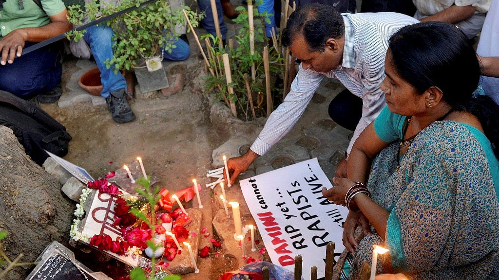 Parents of Nirbhaya, Asha Devi and BN Singh, light candles at a memorial at Jantar Mantar in New Delhi. (Photo: PTI)