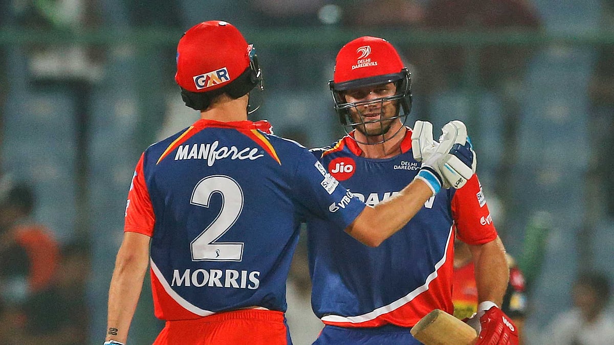 Chris Morris and Corey Anderson celebrate after winning the match. (Photo: AP)