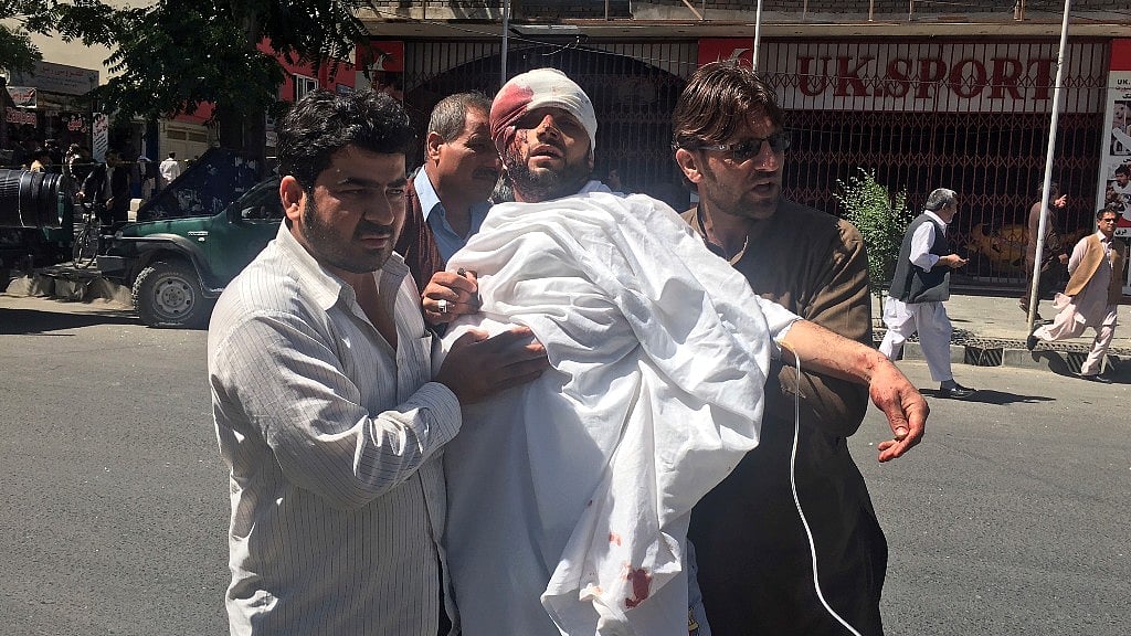 An injured man is cairred after a suicide attack in Kabul, Afghanistan, Wednesday, May 31, 2017.&nbsp;