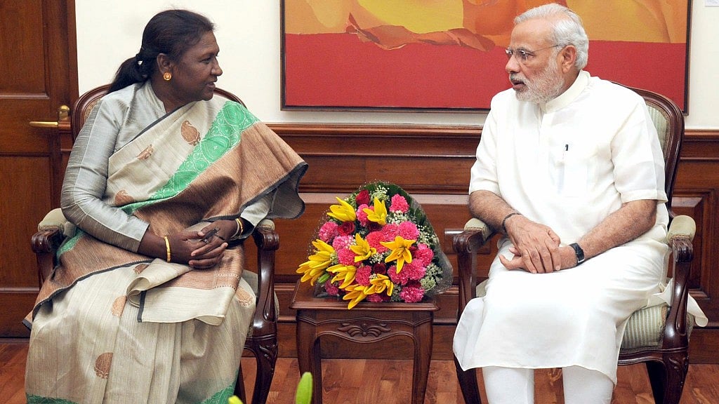 Born into a tribal family in Odisha, Murmu went on to become the first woman to hold the Governor’s office in Jharkhand. (Photo Courtesy: Facebook/<a href="https://www.facebook.com/inbministry/photos/p.1021161554561667/1021161554561667/?type=1&opaqueCursor=AbpWgr9oipQysC8tD1K5ouUmiWiWALgp-yZ_TBJhQpCFvyDNb9eem2DdpmuPH0S99vteWe6eJ0a7p3QjgUUyp_TFenW5ddSQ1FodwolBC3-TMATdZpfuXyIT5cprmA5-8o22tUWktRYIeHsr5tJCGyd5XwKELNIp8HMDeIHnZS5jy9hbTDLlOF0YJ26_Y62Z3b0WKV7KrqfR0JzUAiiadW-PY2YJ5MwMxyyiH2GaDyc2_ejC9mx3bDhcBjJ7Yhn7aWtJEkL2jc6Mm03SsmjF08Dqv-kzzDHcAaEp6IGqnNGy1fEA8Ii7RCb0LMR3P-GCPGMf6hcFg_jPxOSWutAg4OWKOg5-tDOh3OkS3dEbNz70Qa_knhyXesl41giIKCbChQ2tZMLLnuHhm9544uJPNNv-3v7exueUoNEaBPINd8xdYw&theater">@inbministry</a>)