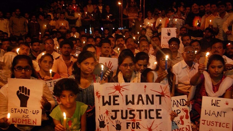 A file photo of an anti-rape candle march. 