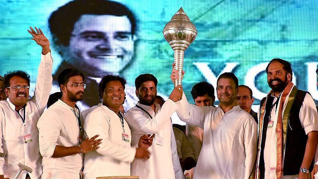 Rahul Gandhi holds out a <i>gada</i> at a rally in Sangareddy on Thursday. (Photo: PTI)