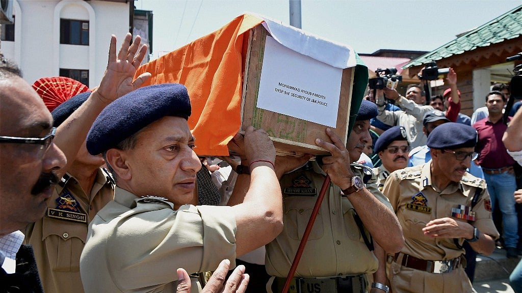 Director General of Jammu and Kashmir Police SP Vaid and other senior officers carrying the coffin of DSP Mohammad Ayub Pandith during a wreath laying ceremony at District Police Lines in Srinagar. 