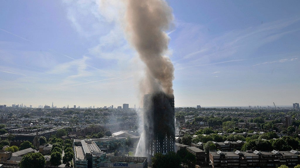 Around 40 fire engines and 200 firefighters were deployed to fight the fire that raged from the second floor to the top floor of a building. (Photo: AP)