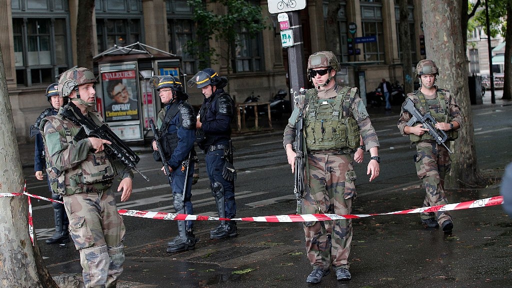Security personnel at the scene of the attack. (Photo: AP/Christophe Ena)