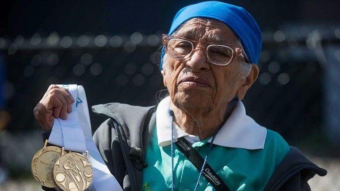 Man Kaur with the gold medals she won in shot put and javelin events. 