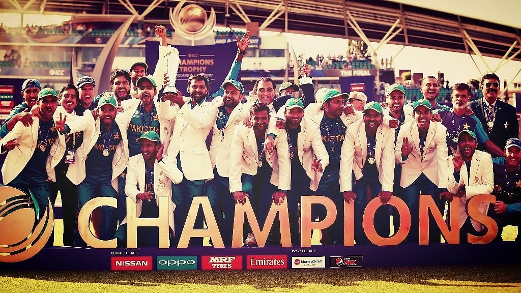 The Pakistan team pose with the ICC Champions Trophy after beating India in the final on Sunday. (Photo: Reuters)