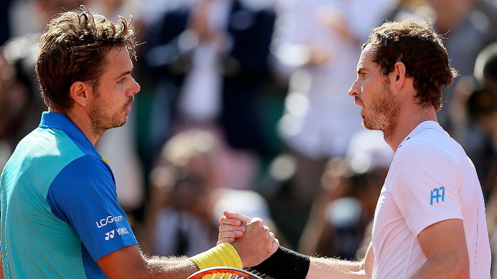 Switzerland’s Stanislas Wawrinka, left, shakes hands with Britain’s Andy Murray after their French Open semi-final clash. (Photo: AP)