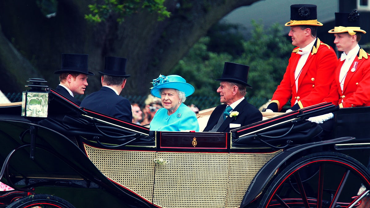 The Queen is never happier than when watching ‘the sport of kings’ (especially when one of her horses wins!). (Photo Courtesy: Shutterstock)