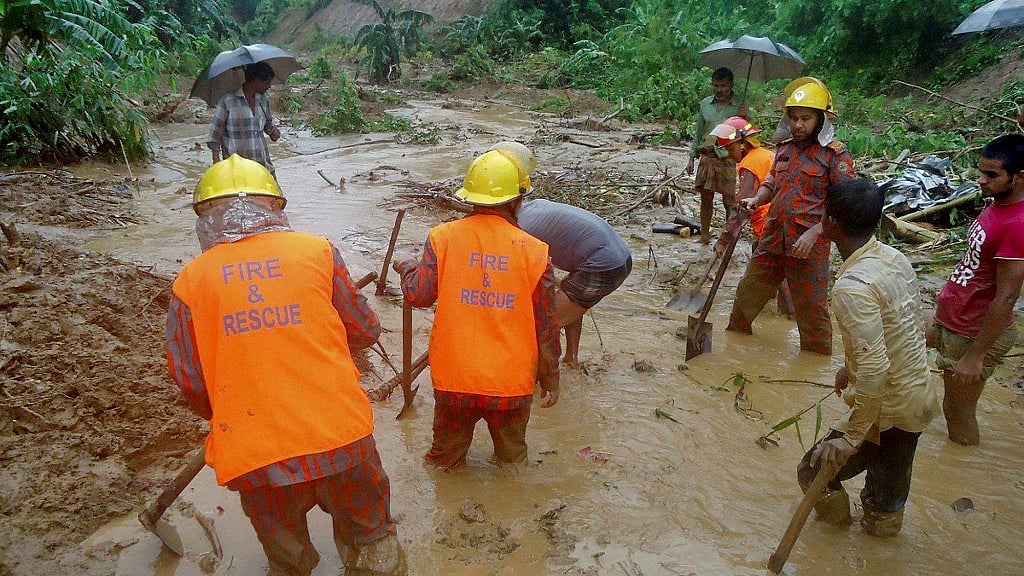 Rescue efforts underway post a landslide at Bandarban district of Bangladesh. (Photo: PTI)